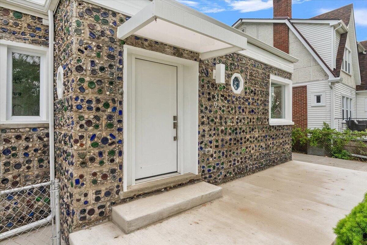 Entry of the Hazel Park bottle house, a facade of concrete block set with glass bottle bottoms, at 39 W Elza Avenue
